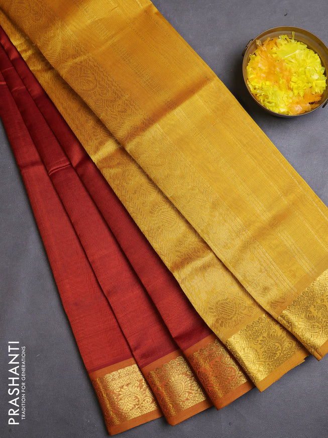 Silk cotton saree rust and mustard yellow with plain body and zari woven border