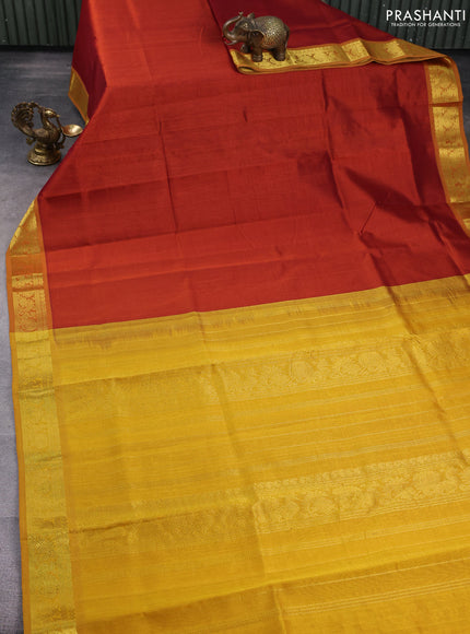 Silk cotton saree rust and mustard yellow with plain body and zari woven border