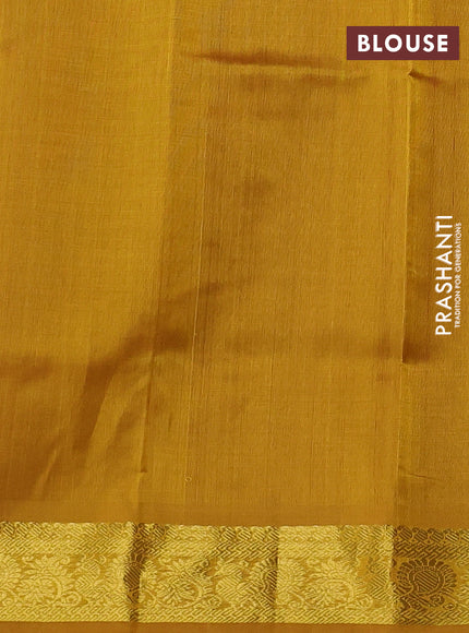 Silk cotton saree rust and mustard yellow with plain body and zari woven border