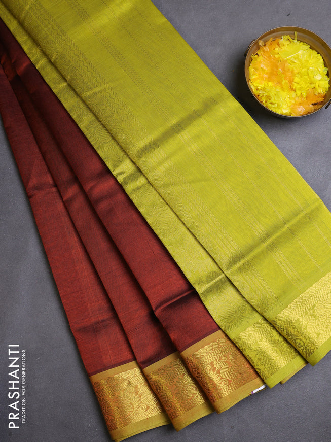 Silk cotton saree rust shade and lime green with plain body and zari woven border