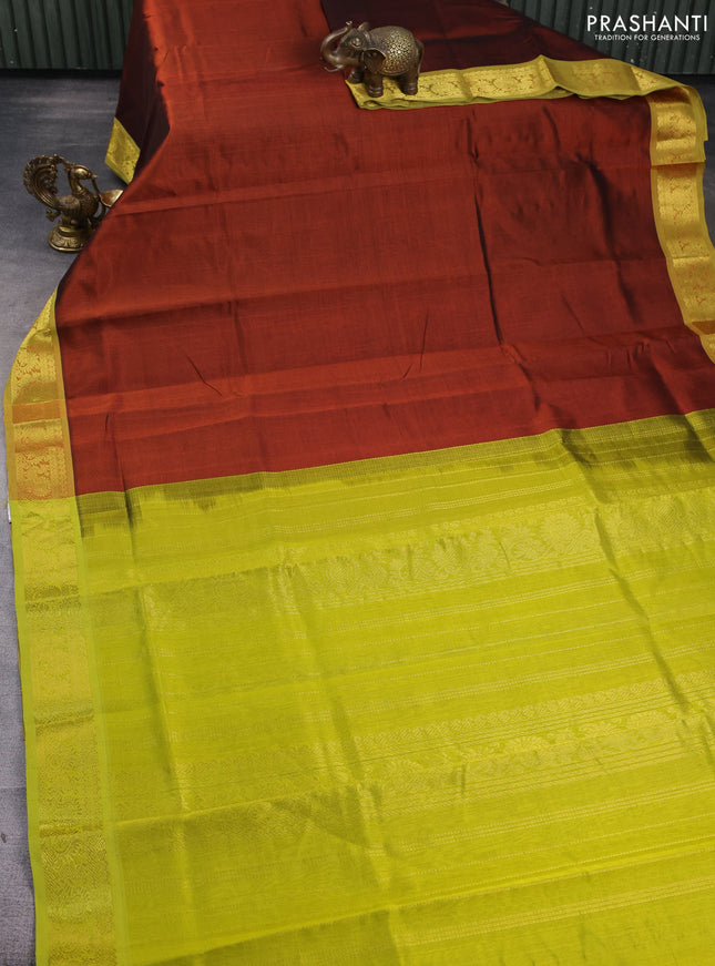 Silk cotton saree rust shade and lime green with plain body and zari woven border
