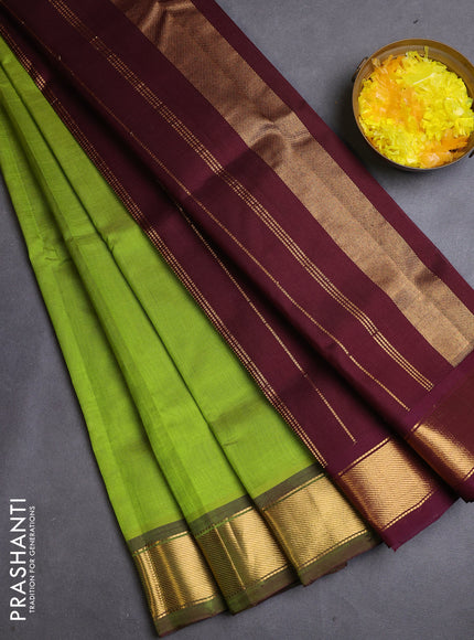Silk cotton saree light green and wine shade with plain body and zari woven border