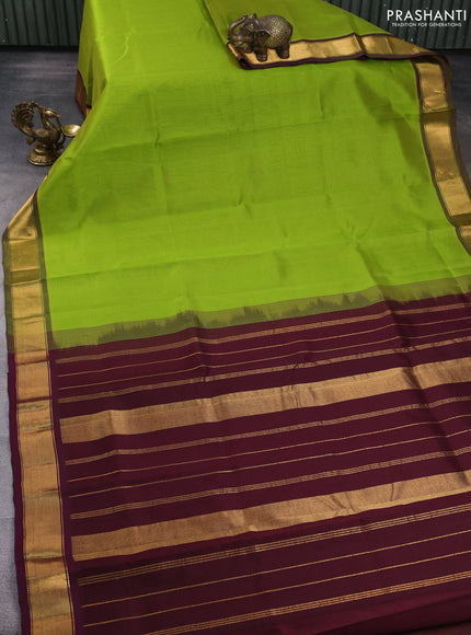 Silk cotton saree light green and wine shade with plain body and zari woven border