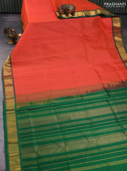 Silk cotton saree orange and green with plain body and zari woven border