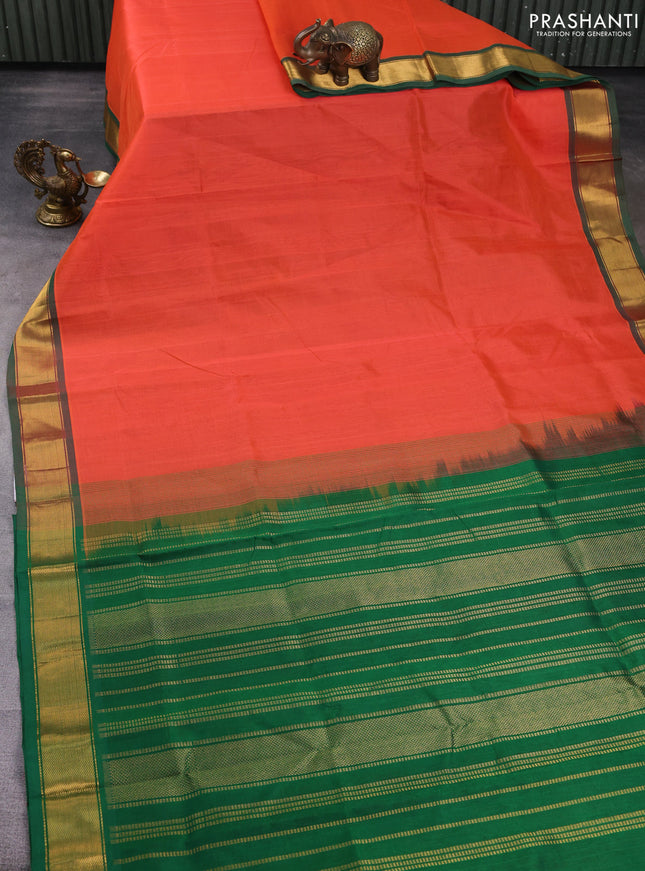 Silk cotton saree orange and green with plain body and zari woven border