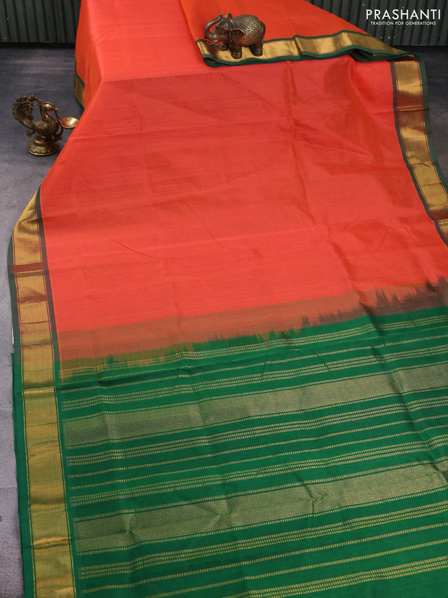 Silk cotton saree orange and green with plain body and zari woven border