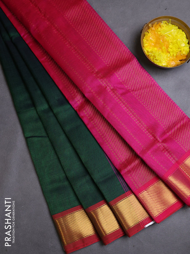 Silk cotton saree green and pink with plain body and zari woven border