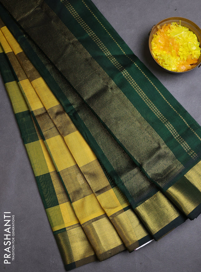 Silk cotton saree yellow and bottle green with allover paalum pazhamum checks & buttas and zari woven border