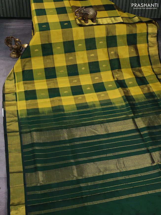 Silk cotton saree yellow and bottle green with allover paalum pazhamum checks & buttas and zari woven border