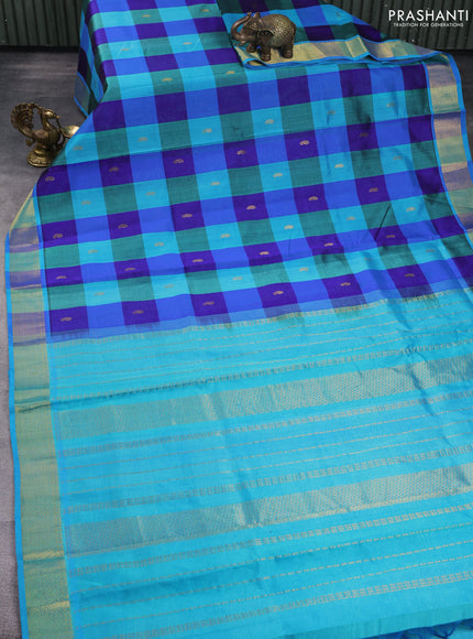 Silk cotton saree blue and teal blue with allover paalum pazhamum checks & buttas and zari woven border