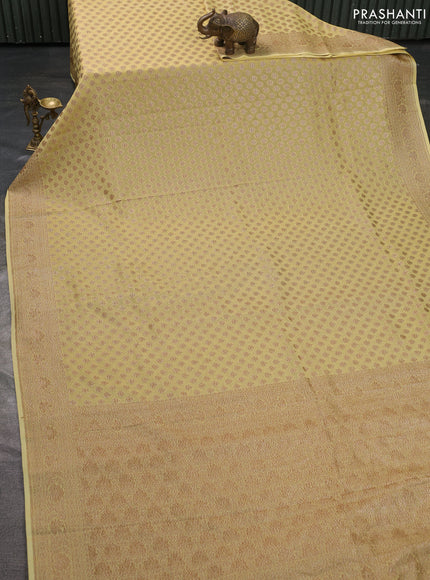 Pure banarasi georgette saree pale yellow with woven buttas and woven border
