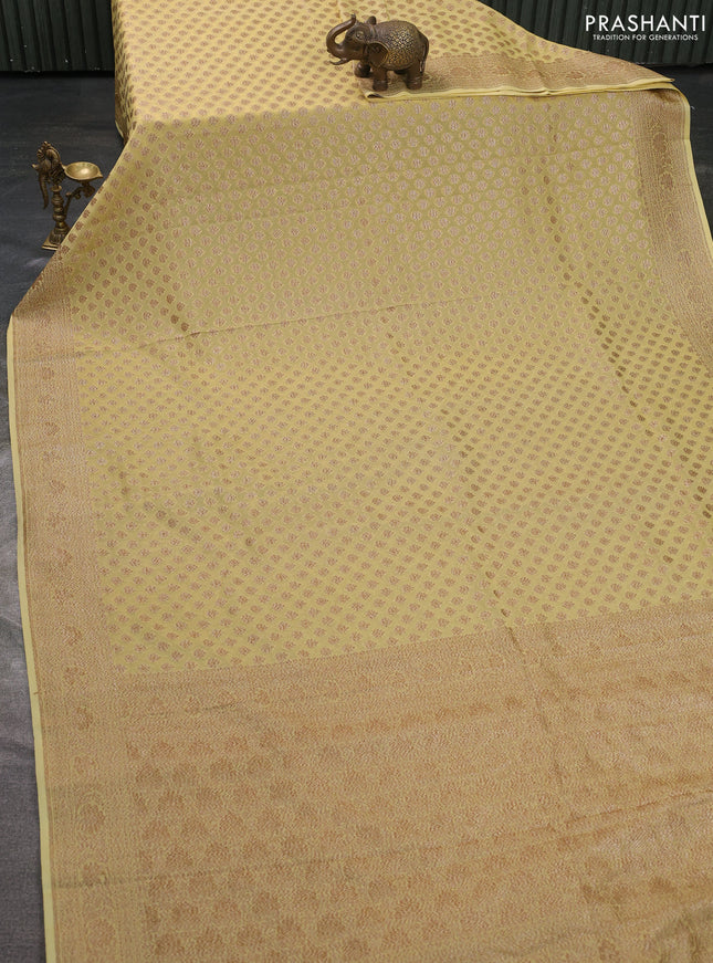 Pure banarasi georgette saree pale yellow with woven buttas and woven border