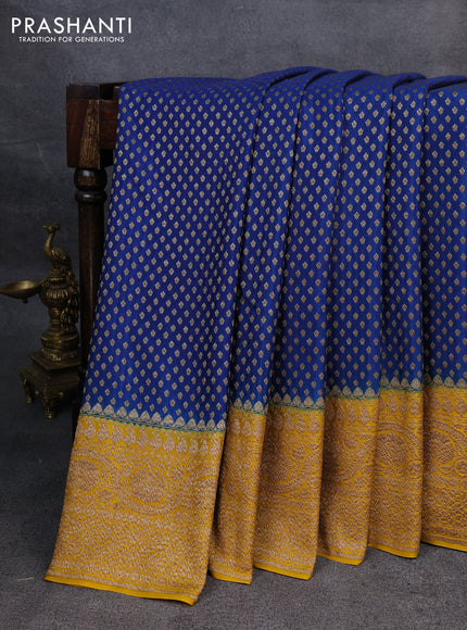 Pure banarasi georgette saree blue and yellow with woven buttas and woven border