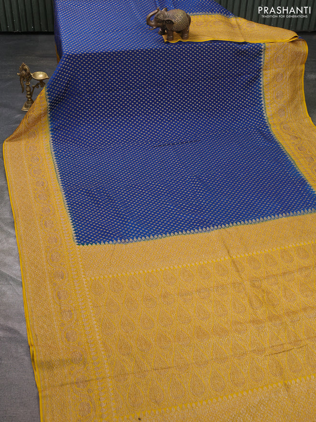 Pure banarasi georgette saree blue and yellow with woven buttas and woven border