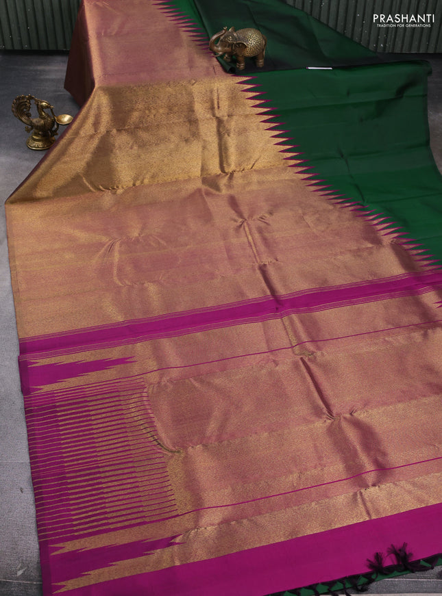 Pure kanchipuram silk saree green and purple with plain body and rising border