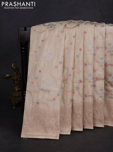 Banarasi silk saree cream with allover zari weaves and zari woven border