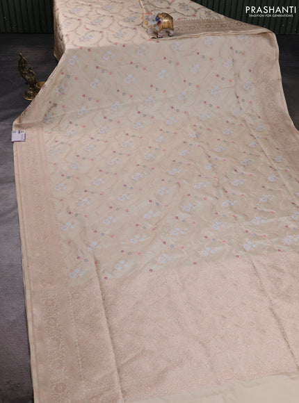 Banarasi silk saree cream with allover zari weaves and zari woven border