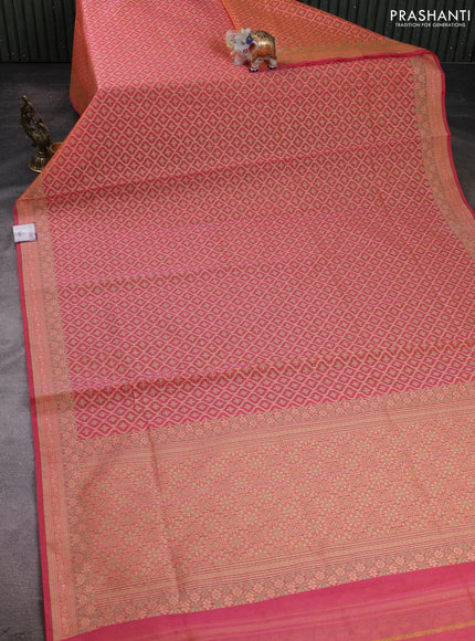 Banarasi silk cotton saree peach orange with allover thread weaves and woven border