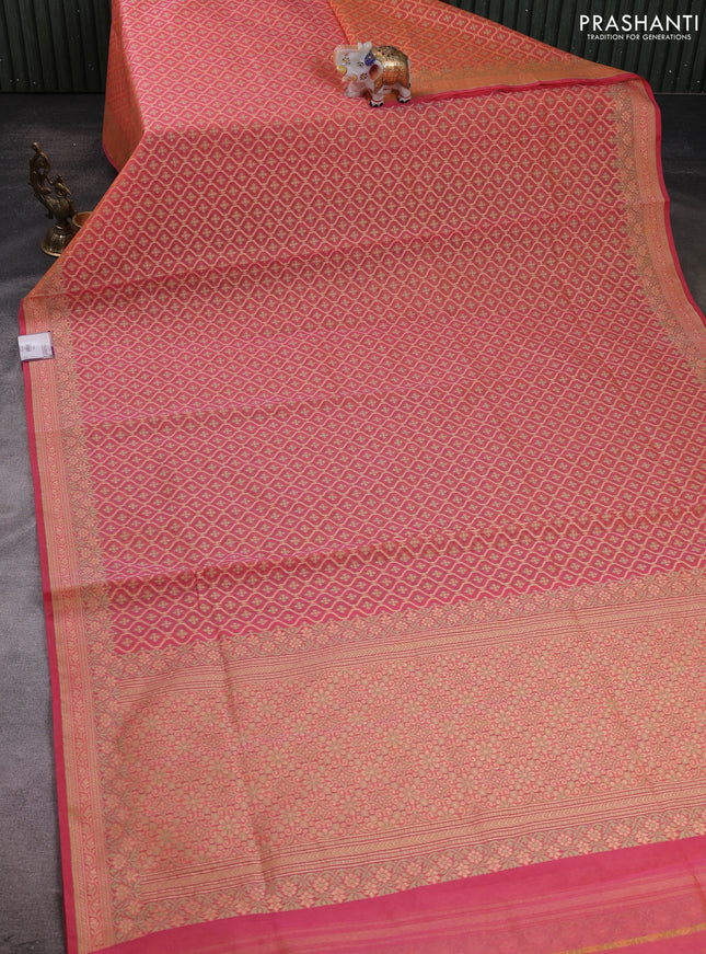 Banarasi silk cotton saree peach orange with allover thread weaves and woven border