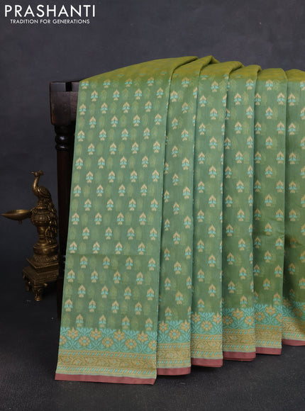 Banarasi silk cotton saree green shade with allover thread weaves and woven border