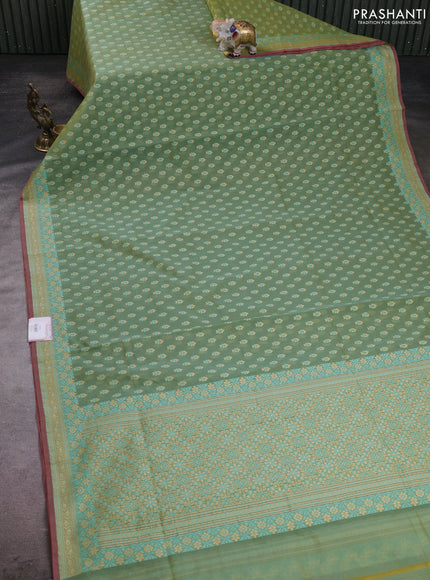 Banarasi silk cotton saree green shade with allover thread weaves and woven border