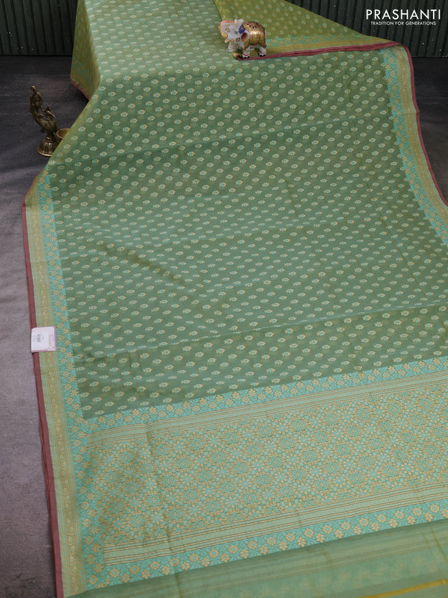 Banarasi silk cotton saree green shade with allover thread weaves and woven border