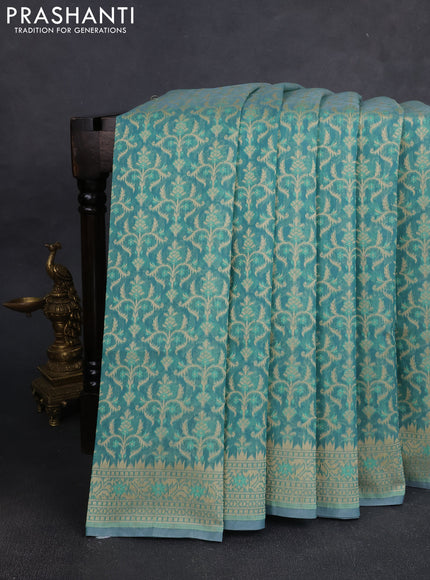 Banarasi silk cotton saree teal shade with allover thread weaves and woven border