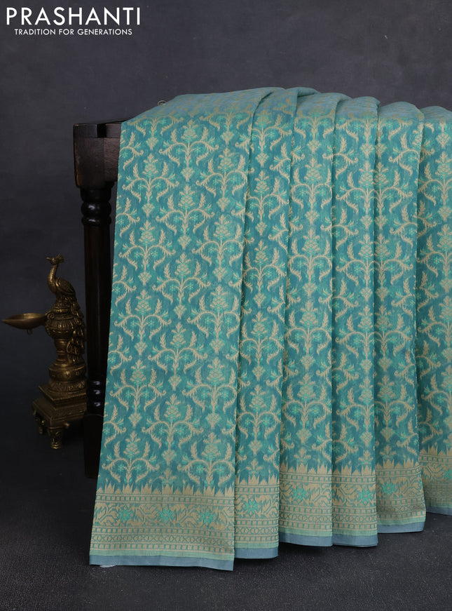 Banarasi silk cotton saree teal shade with allover thread weaves and woven border