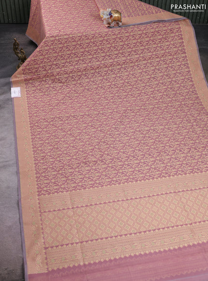 Banarasi silk cotton saree peach shade with allover thread weaves and woven border
