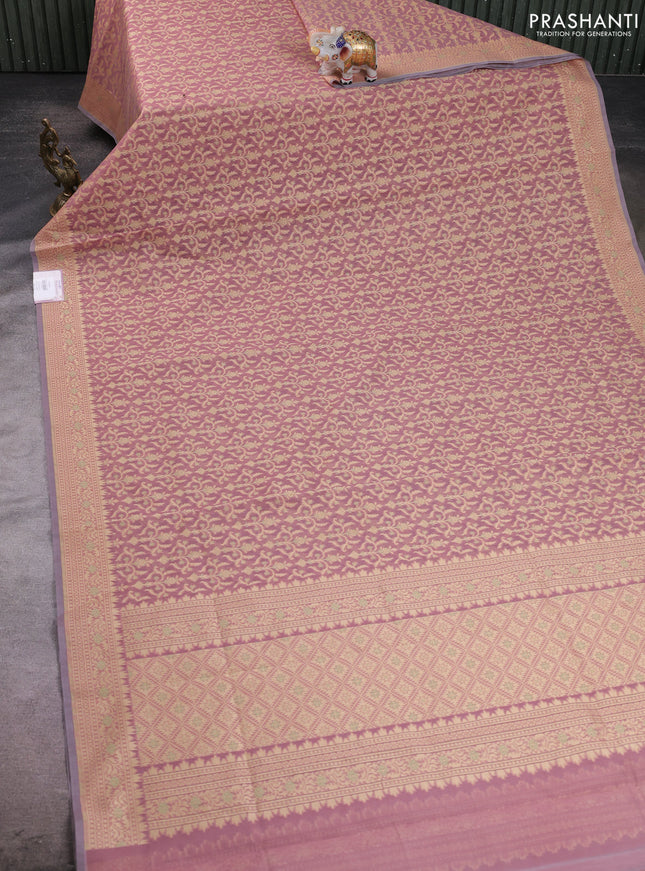 Banarasi silk cotton saree peach shade with allover thread weaves and woven border