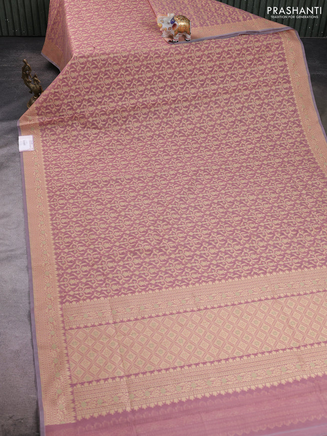 Banarasi silk cotton saree peach shade with allover thread weaves and woven border