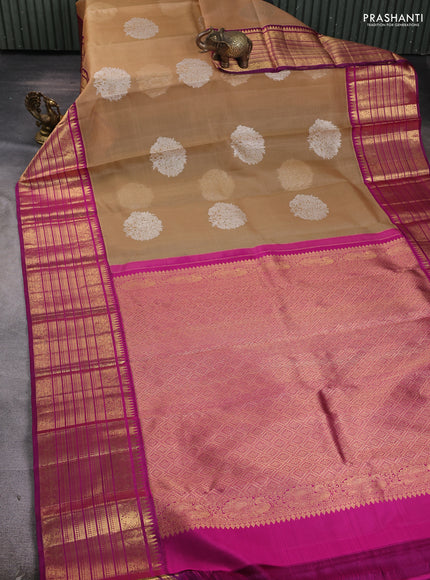 Pure Kora kanchipuram silk saree sandal and purple with silver zari woven coin buttas and long zari woven border