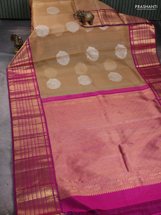 Pure Kora kanchipuram silk saree sandal and purple with silver zari woven coin buttas and long zari woven border