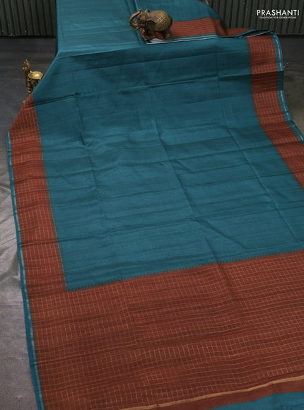 Semi tussar saree peacock green and brown with plain body and temple design zari checked border