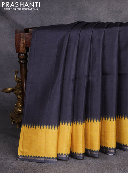 Semi tussar saree black and yellow with plain body and temple design zari checked border