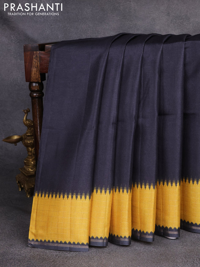 Semi tussar saree black and yellow with plain body and temple design zari checked border