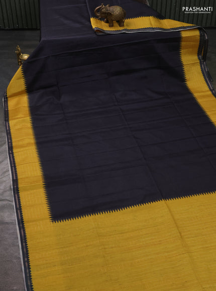 Semi tussar saree black and yellow with plain body and temple design zari checked border