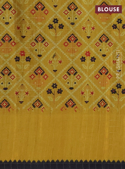 Semi tussar saree black and yellow with plain body and temple design zari checked border