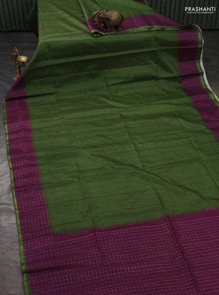 Semi tussar saree green and purple with plain body and temple design zari checked border