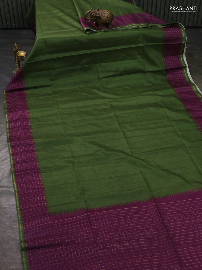 Semi tussar saree green and purple with plain body and temple design zari checked border