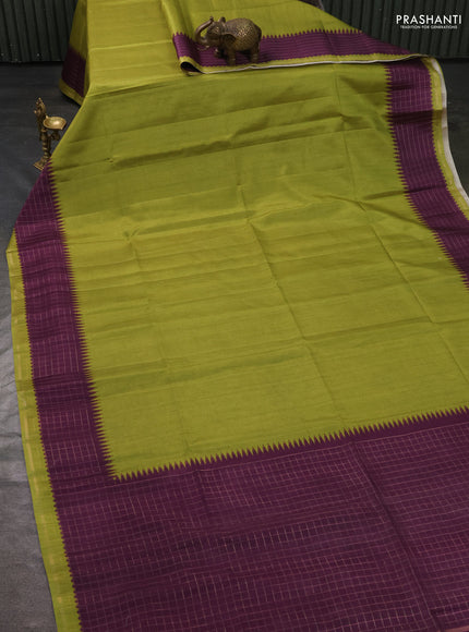 Semi tussar saree light green and purple with plain body and temple design zari checked border