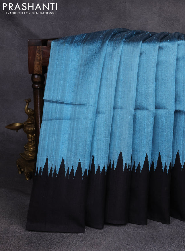 Pure dupion silk saree light blue and black with plain body and temple woven border