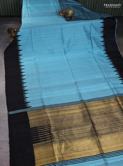 Pure dupion silk saree light blue and black with plain body and temple woven border
