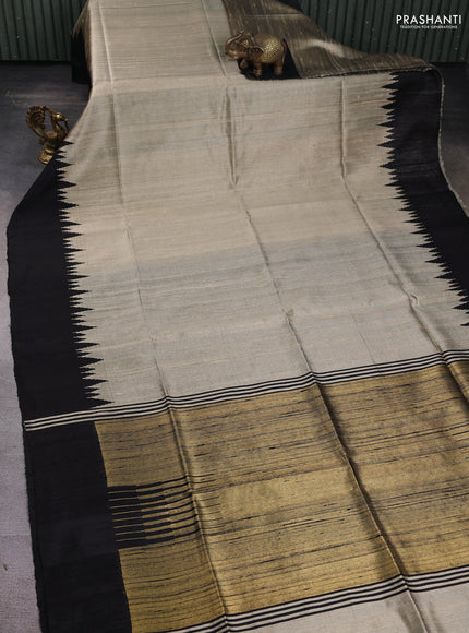 Pure dupion silk saree beige and black with plain body and temple woven border