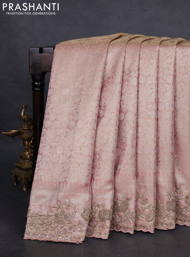 Kanchipuram silk saree peach pink with allover zari woven brocade weaves and embroidered border