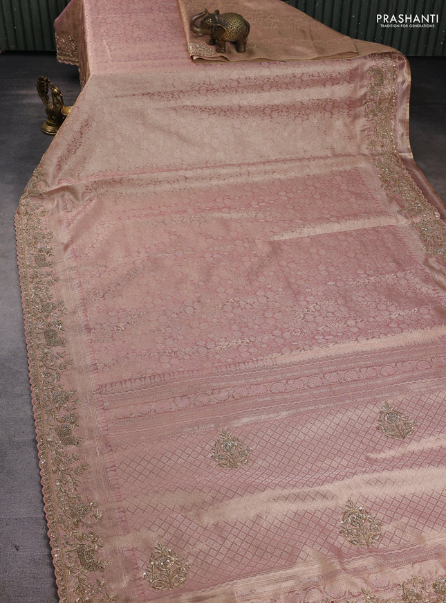 Kanchipuram silk saree peach pink with allover zari woven brocade weaves and embroidered border
