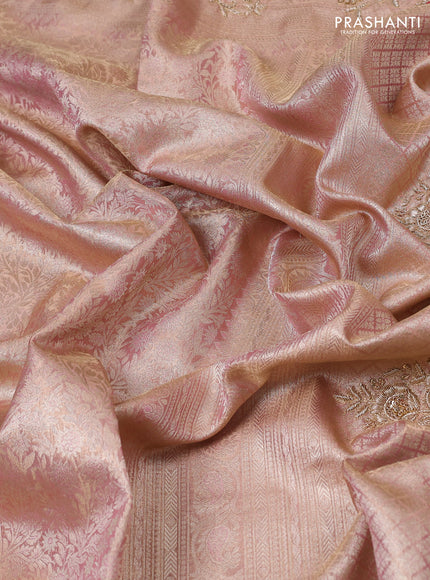 Kanchipuram silk saree peach pink with allover zari woven brocade weaves and embroidered border