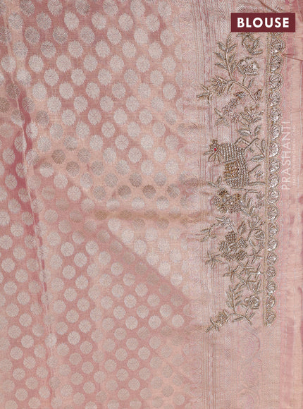 Kanchipuram silk saree peach pink with allover zari woven brocade weaves and embroidered border