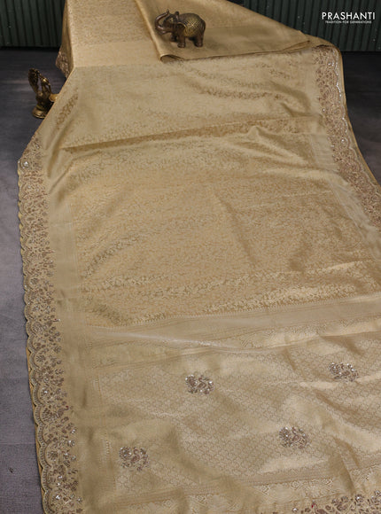 Kanchipuram silk saree gold with allover zari woven brocade weaves and embroidered border