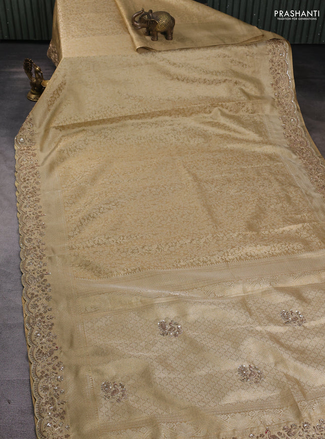 Kanchipuram silk saree gold with allover zari woven brocade weaves and embroidered border